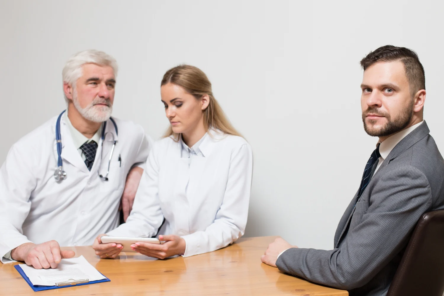 A lawyer sitting at the table with a doctor and another woman