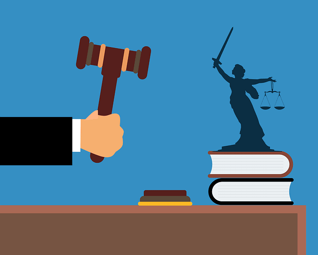 A person holding a gavel with books and judicial logo 